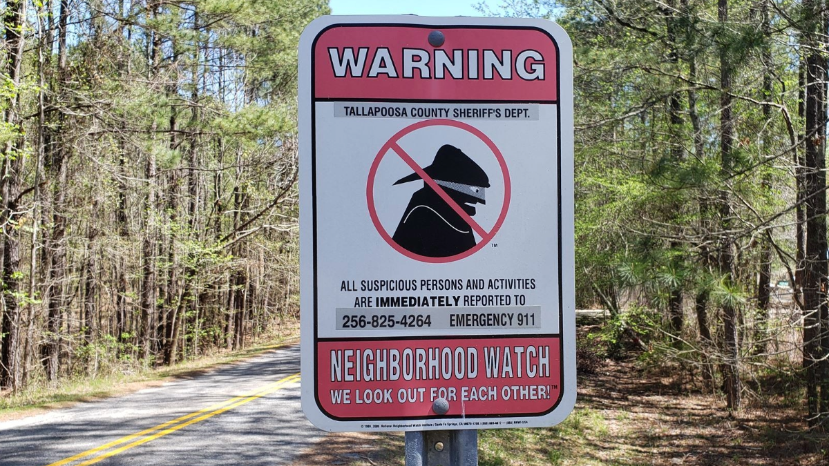 Tallapoosa Sheriff's Department — Masked Bad Guy reflective Neighborhood Watch sign installation